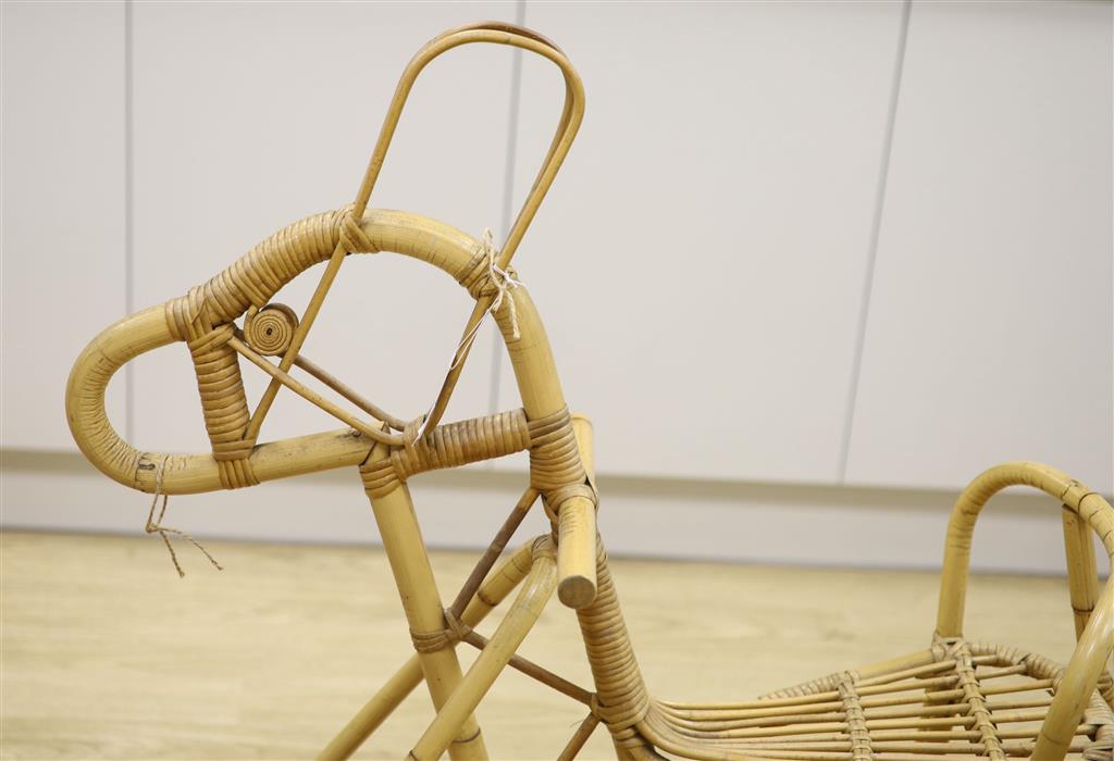 A bamboo and wicker rocking horse